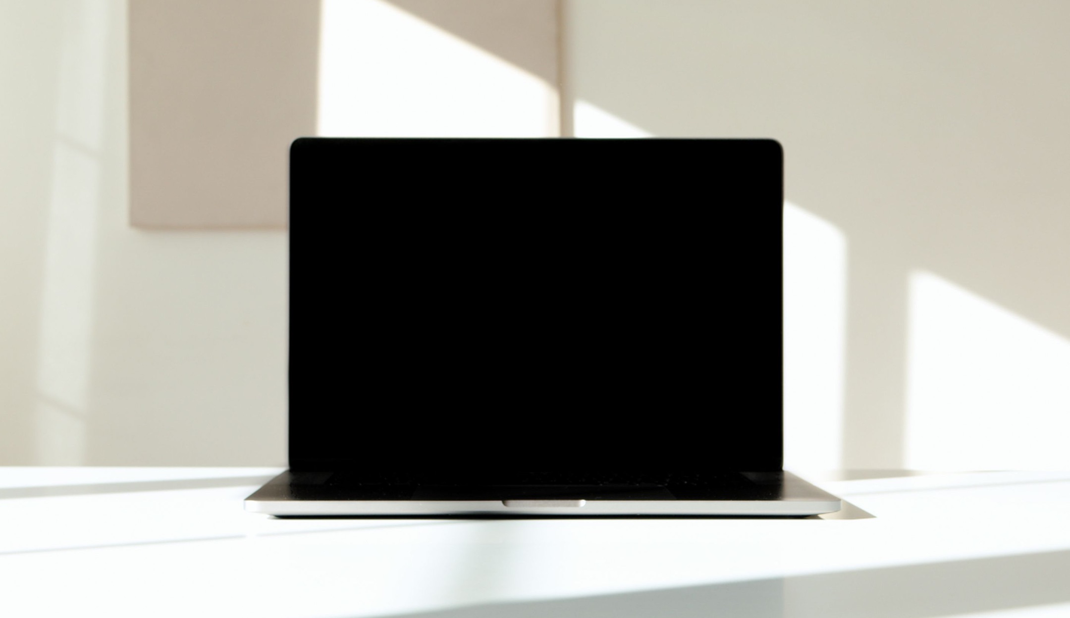 Laptop on a white desk